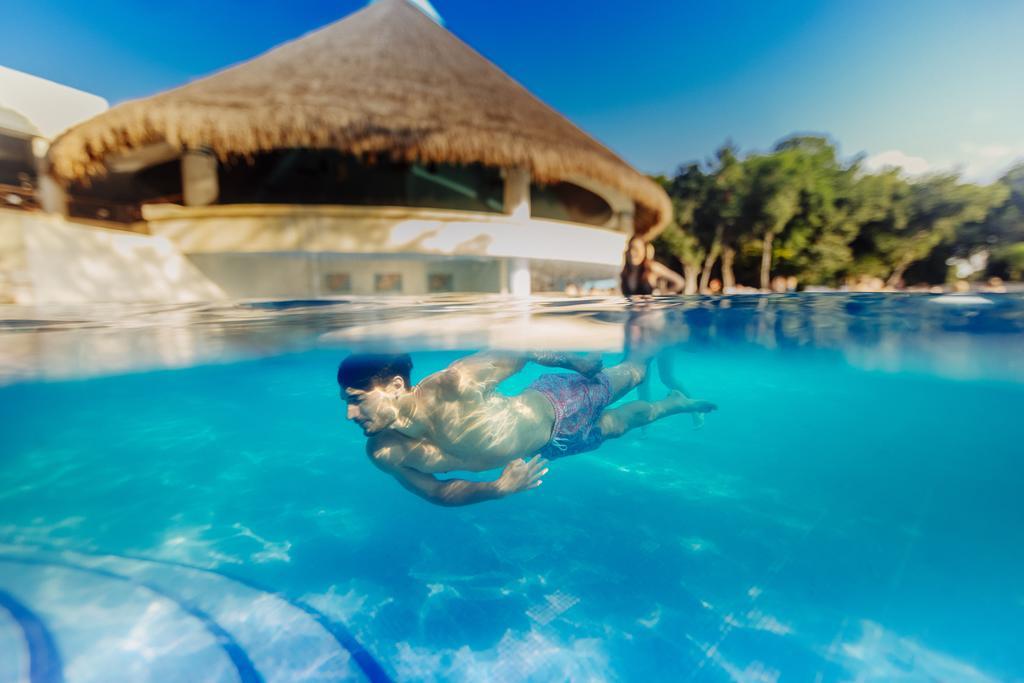 Occidental At Xcaret Destination Hotel Xcaret Park Екстериор снимка Swimming in a pool